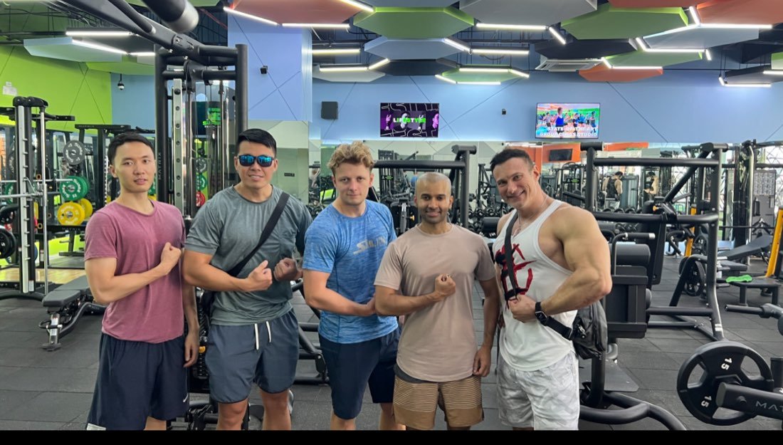 Group of successful male clients at the gym after a Pickup Alpha coaching session